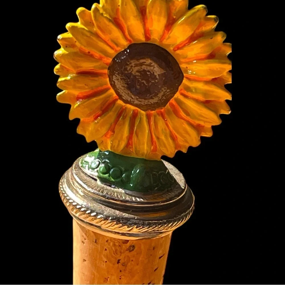 Vintage wine bottle cork stopper, with a pewter, painted, sunflower on top